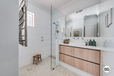Small traditional master bathroom in Perth with light wood cabinets, a corner shower, white tile, ceramic tile, white walls, porcelain floors, a drop-in sink, solid surface benchtops, multi-coloured floor, an open shower, white benchtops, a niche, a single vanity and a built-in vanity.