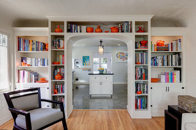 Large transitional open concept light wood floor family room photo in Los Angeles with white walls