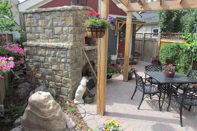 Example of a small arts and crafts patio design in Calgary