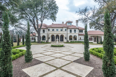 Huge elegant white three-story exterior home photo in Dallas