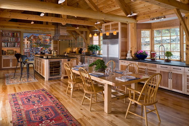 Kitchen - large traditional medium tone wood floor kitchen idea in Burlington with an undermount sink, recessed-panel cabinets, stainless steel appliances and an island