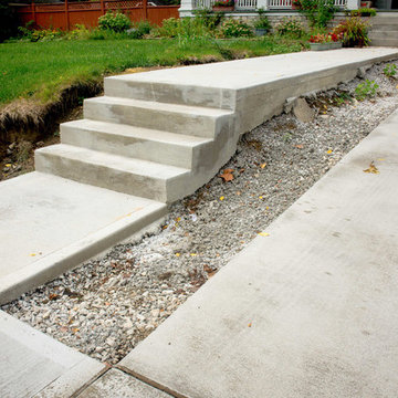 Clean Concrete Drive with Bold Brick Accents