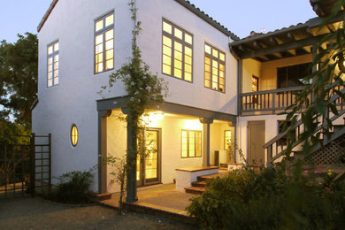 Example of a large tuscan white two-story stucco exterior home design in San Francisco