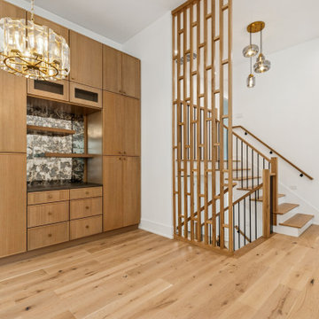 Curated Entryway with Full-Height Cabinetry & Architectural Stair Detail