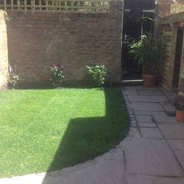 From junk yard to lawned patio
