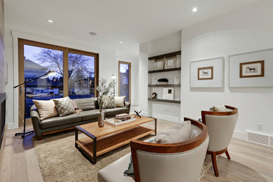 Example of a transitional home design design in Calgary