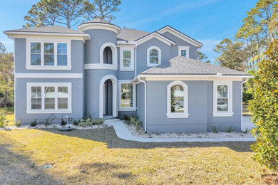 Tuscan home design photo in Jacksonville