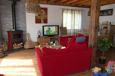 Mid-sized country open concept family room in Lyon with a freestanding tv.