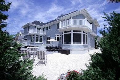 Coastal gray two-story wood exterior home idea in New York