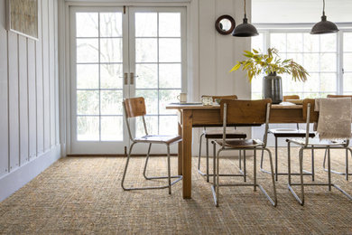 Design ideas for a farmhouse dining room in Other with white walls and carpet.