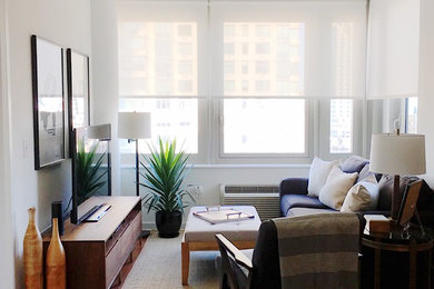 Living room - mid-sized modern open concept medium tone wood floor and brown floor living room idea in New York with white walls, no fireplace and a tv stand