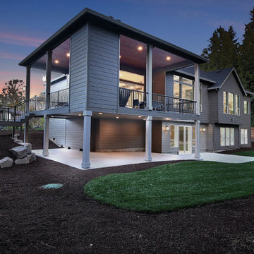 2-Story Covered Outdoor Living Area at Dusk - The Genesis - Family Super Ranch