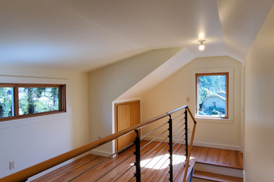 Mid-sized arts and crafts wooden straight mixed material railing staircase photo in Seattle with painted risers