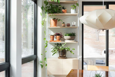 Inspiration for a mid-sized contemporary kitchen/dining room combo remodel in Denver with white walls