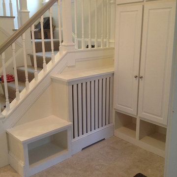 Entryway closets, radiator cover and bench