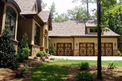 Inspiration for a large craftsman beige two-story mixed siding exterior home remodel in Atlanta with a shingle roof