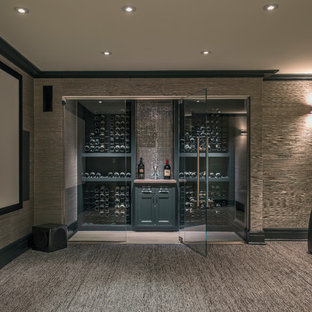 Large elegant enclosed carpeted home theater photo in Providence with a projector screen and gray walls