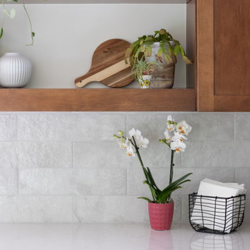 From Stark to Stylish: A Warm Kitchen Remodel with Evergreen Charm