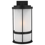 Sea Gull Lighting - Sea Gull Wilburn Large 1 Light Outdoor Wall Lantern, Black/Satin - With a nod to retro-industrial chic, the Wilburn outdoor fixtures wraps a white frosted glass shade in a fun metal cage to create a casual and easygoing look. Offered in Antique Bronze and Black finishes with Etched White glass, the assortment includes a one-light outdoor pendant, small medium, large, and extra-large one-light outdoor wall lanterns, a one-light out door post lantern and a one-light outdoor ceiling flush mount. Both incandescent lamping and ENERGY STAR-qualified LED lamping are available for most of the fixtures, and some can easily convert to LED by purchasing LED replacement lamps sold separately.