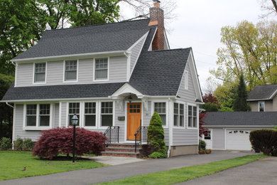 Mid-sized traditional gray two-story mixed siding exterior home idea in New York