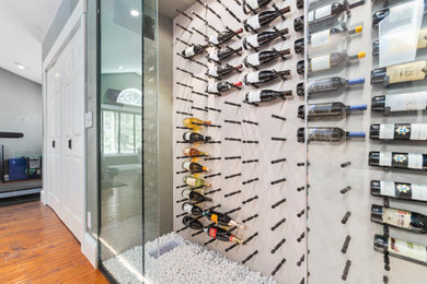 Example of a small minimalist wine cellar design in Seattle