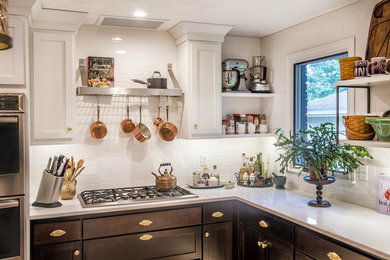Example of a mid-sized transitional kitchen design in Other with shaker cabinets, dark wood cabinets, white backsplash, subway tile backsplash and stainless steel appliances