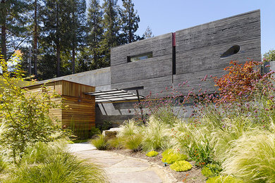 Example of a large trendy gray two-story concrete exterior home design in San Francisco