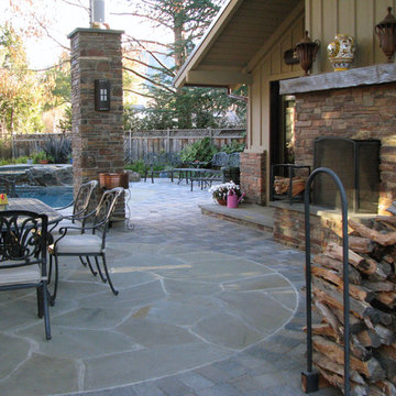 outdoor living area with masonry fireplace