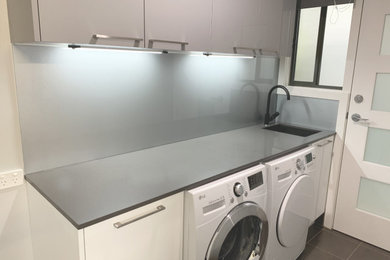 Design ideas for a modern laundry room in Sydney.