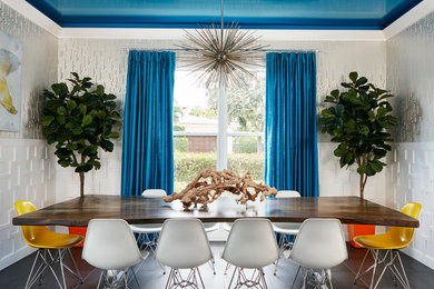 Example of a trendy dining room design in Miami with no fireplace