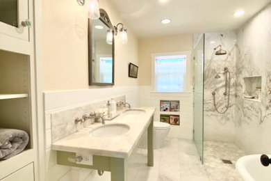 Bathroom - mid-sized cottage master white tile and stone slab marble floor, white floor, double-sink and shiplap wall bathroom idea in Sacramento with furniture-like cabinets, green cabinets, a one-piece toilet, yellow walls, an undermount sink, marble countertops, white countertops, a niche and a freestanding vanity