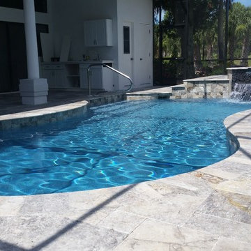 Glacier Travertine Deck and Glass tile on Pool