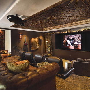Example of a mid-sized tuscan enclosed porcelain floor home theater design in Albuquerque with brown walls and a projector screen