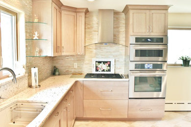 Example of a mid-sized trendy u-shaped porcelain tile enclosed kitchen design in Philadelphia with a single-bowl sink, shaker cabinets, light wood cabinets, quartz countertops, beige backsplash, glass tile backsplash, stainless steel appliances and no island