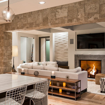 Coastal Living Room With Modern Fixtures and Stone Fireplace