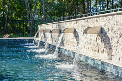 Example of a mid-sized backyard rectangular pool fountain design in Atlanta