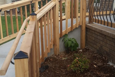 Mid-sized arts and crafts concrete front porch idea in Wichita