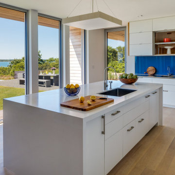 Modern Kitchen with Island and Blue Glass Backsplash