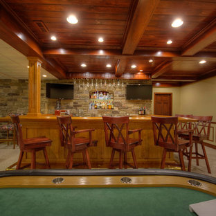 Photo of a large traditional basement in Philadelphia with beige walls and carpet.