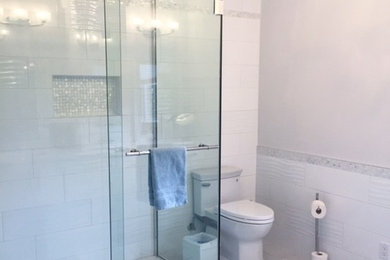 Mid-sized trendy white tile and porcelain tile porcelain tile and gray floor bathroom photo in Other with a two-piece toilet, gray walls and an undermount sink