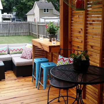 Pergola that extends down to deck for sun screen and privacy
