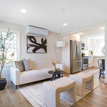 Open Living Room to Kitchen with Mini-Split and Oak Floors – Seattle Bungalow
