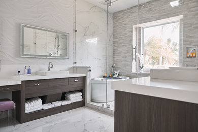Large trendy master white tile and marble tile marble floor and white floor bathroom photo in Austin with flat-panel cabinets, dark wood cabinets, white walls, a vessel sink, solid surface countertops, a hinged shower door and white countertops