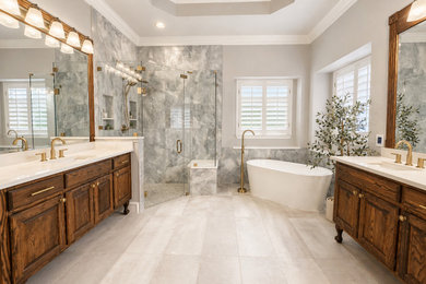 Inspiration for a mid-sized transitional master gray tile and porcelain tile porcelain tile, gray floor and double-sink bathroom remodel in Dallas with dark wood cabinets, gray walls, an undermount sink, quartzite countertops, a hinged shower door, white countertops and a freestanding vanity