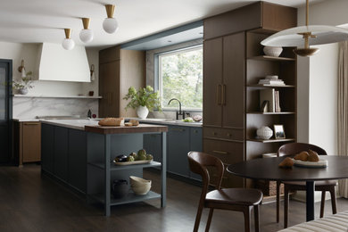 Eat-in kitchen - mid-sized transitional u-shaped dark wood floor and brown floor eat-in kitchen idea in DC Metro with a single-bowl sink, flat-panel cabinets, medium tone wood cabinets, quartz countertops, white backsplash, quartz backsplash, paneled appliances, an island and white countertops