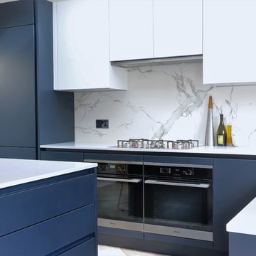 Dark Blue Handleless Kitchen with Copper Radiator