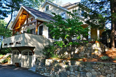 Large trendy yellow three-story wood exterior home photo in Boston