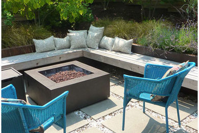 Design ideas for a modern full sun backyard concrete paver landscaping in Seattle.