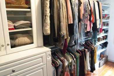 Example of a large gender-neutral closet design in New York