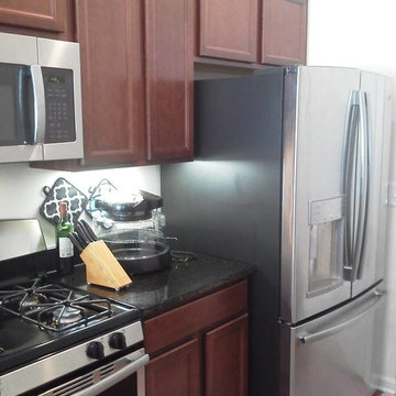Upper cabinet above refrigerator bumped out - before